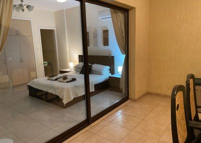 Primary bedroom with balcony